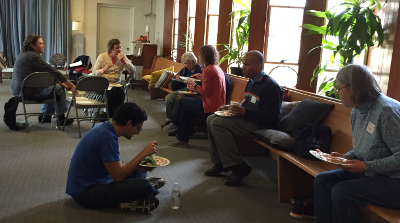 Members eating together in open room